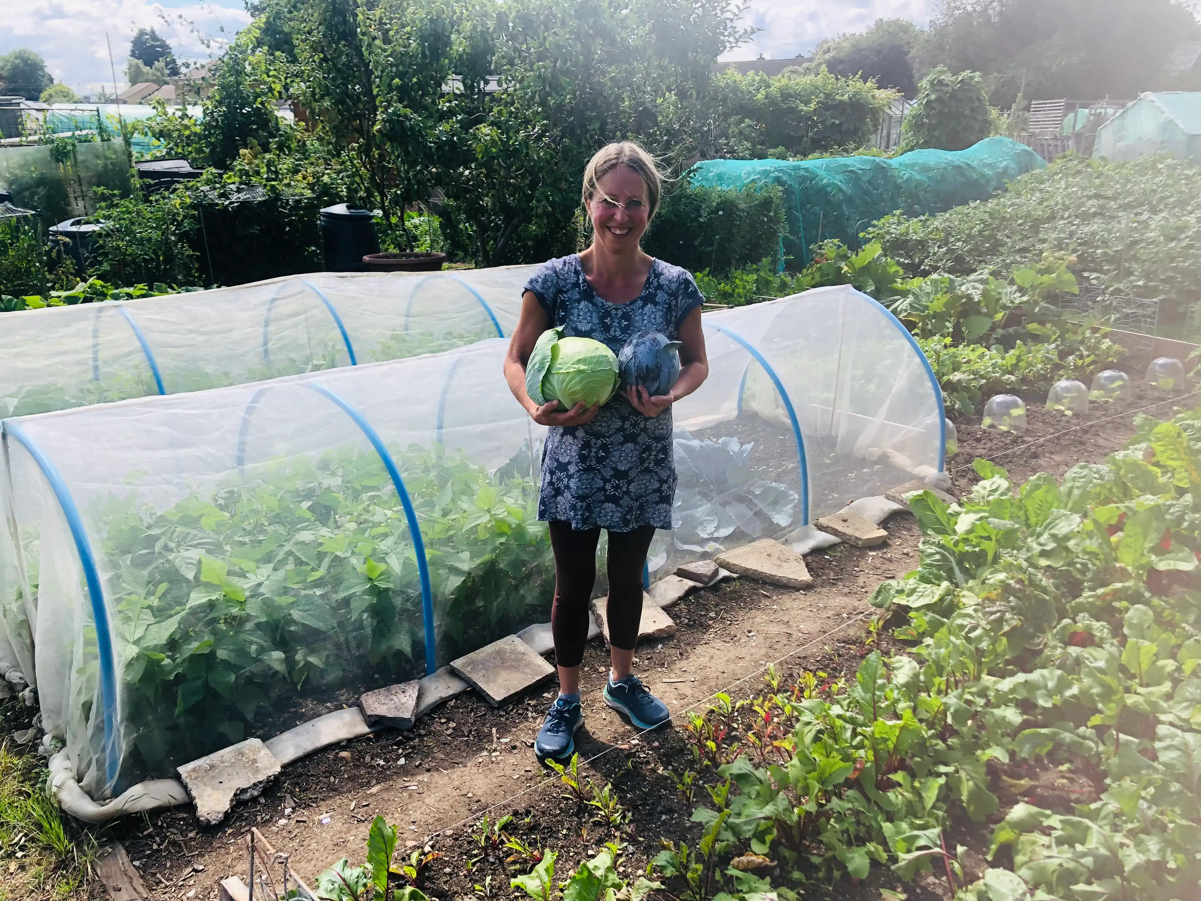 Vicky Salter holding a cabbage from the allotment