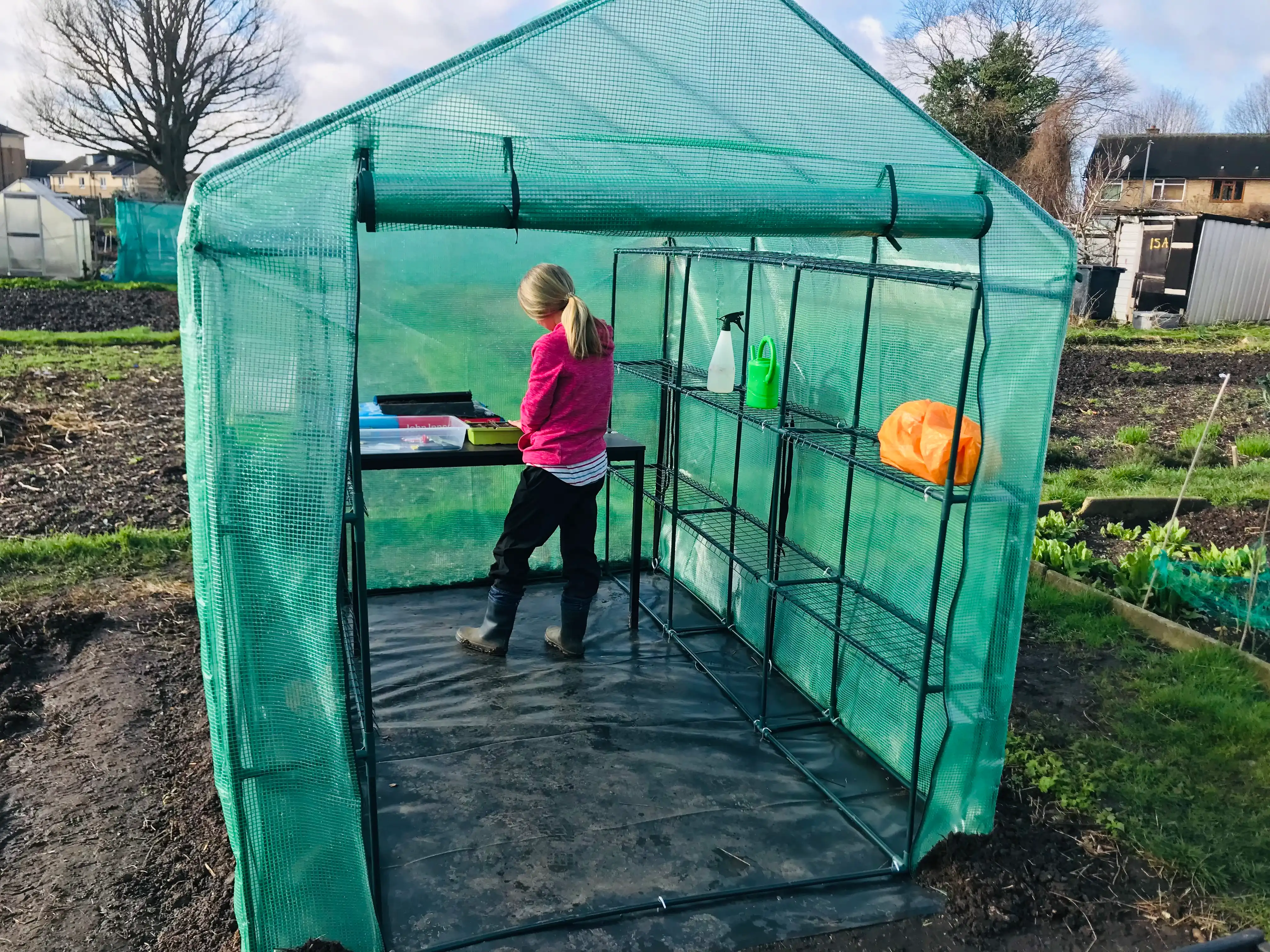 Vicky Salter sowing seeds in greenhouse