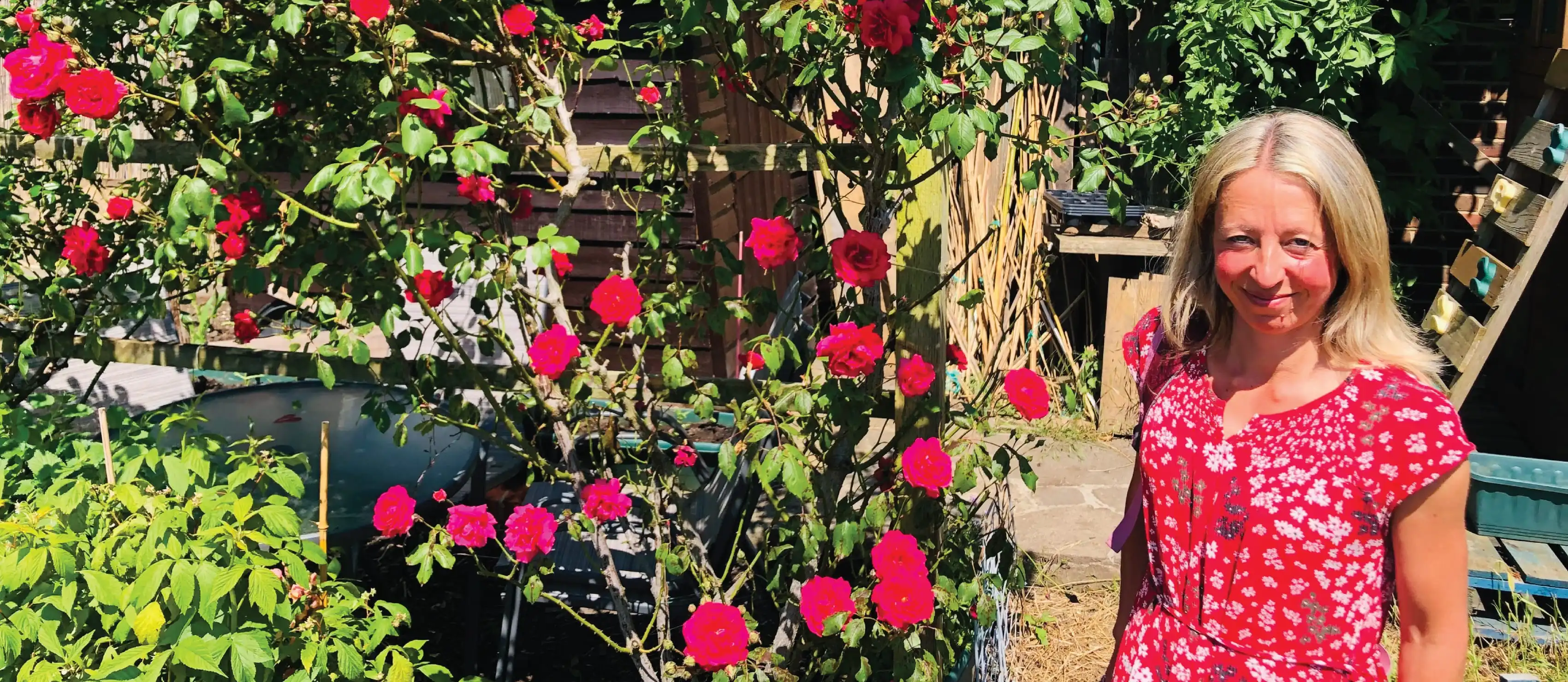 Vicky Salter in front of roses