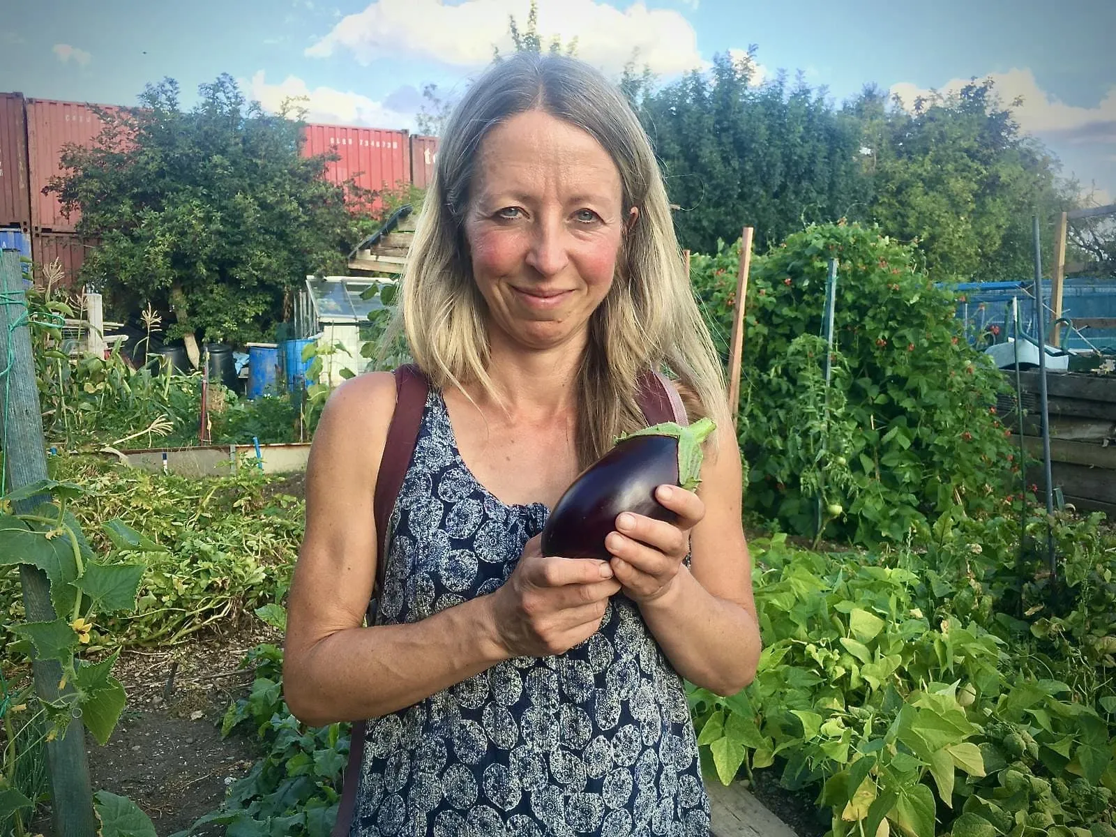 Vicky Salter holding an aubergine.