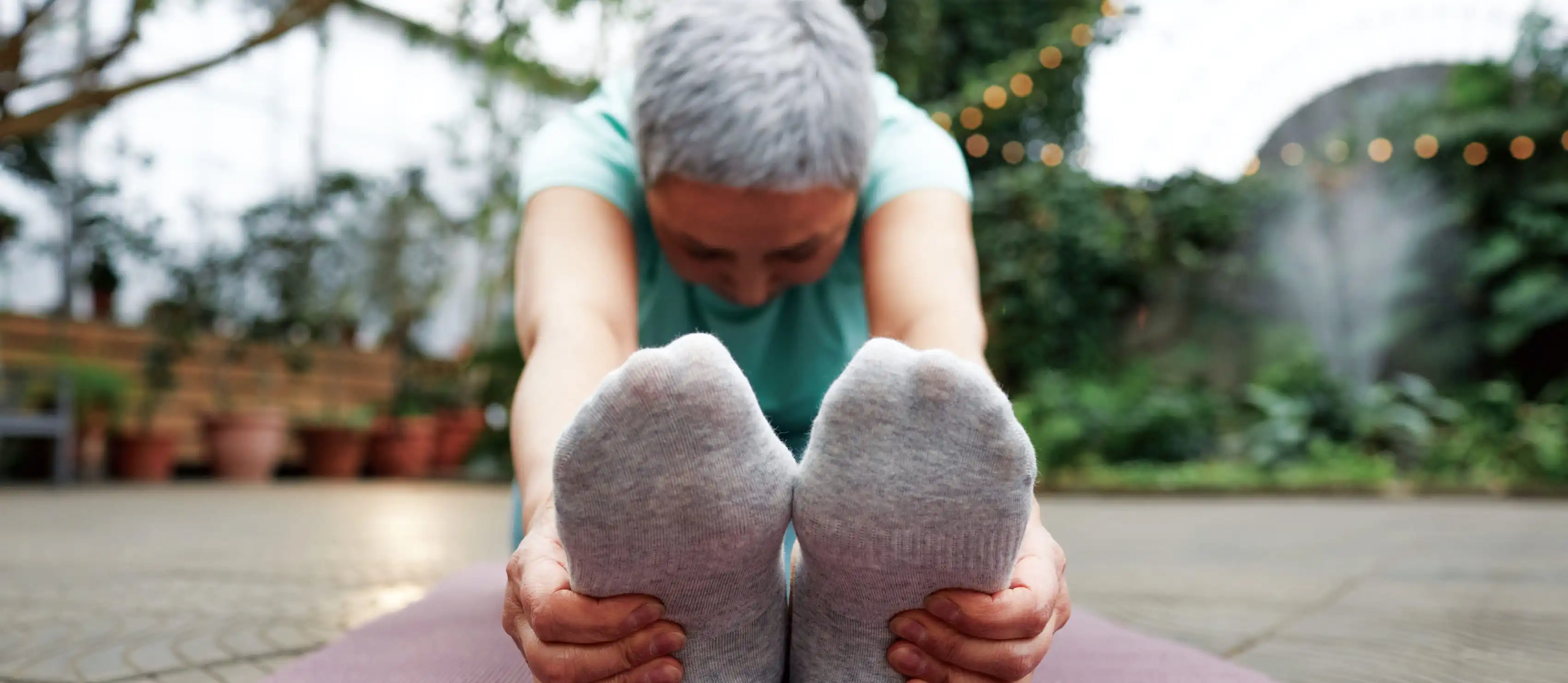 Woman doing seated forward fold