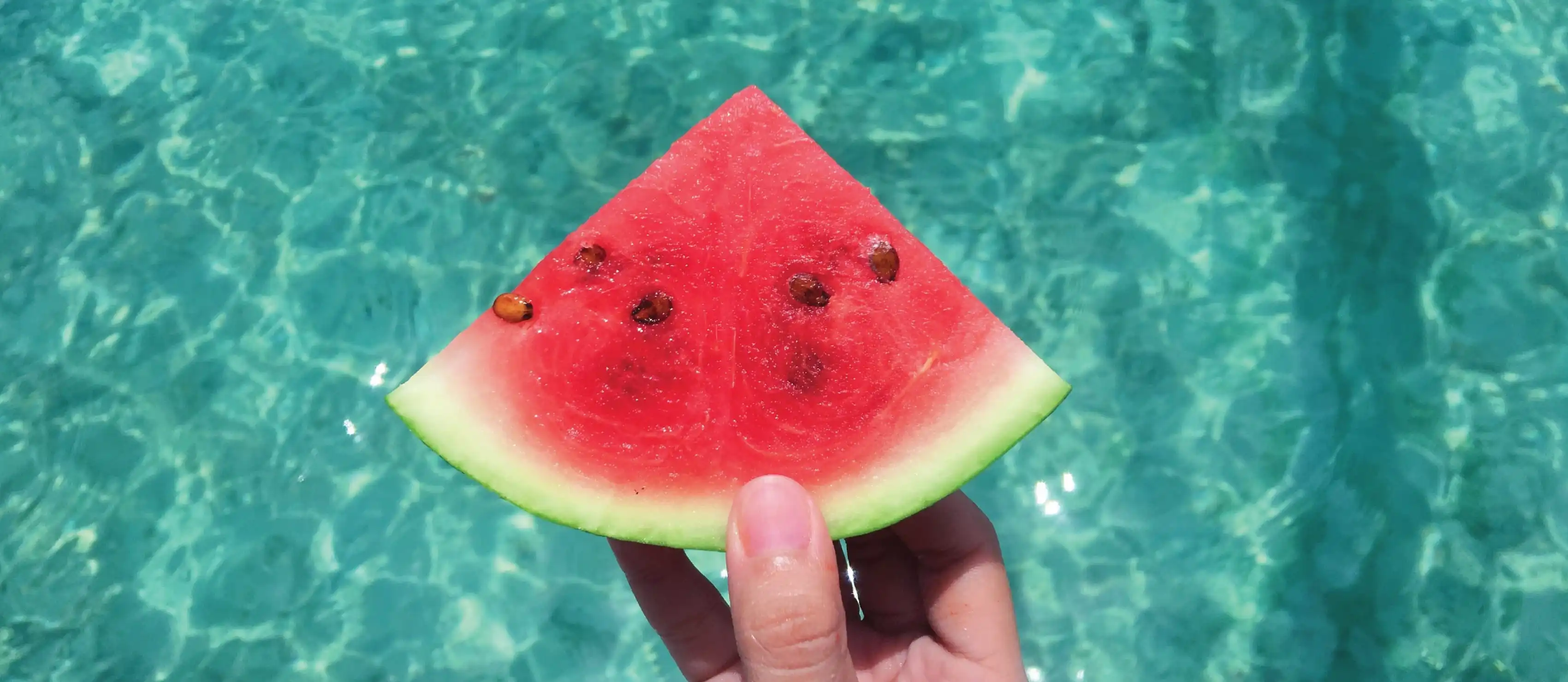 Watermelon over a swimming pool