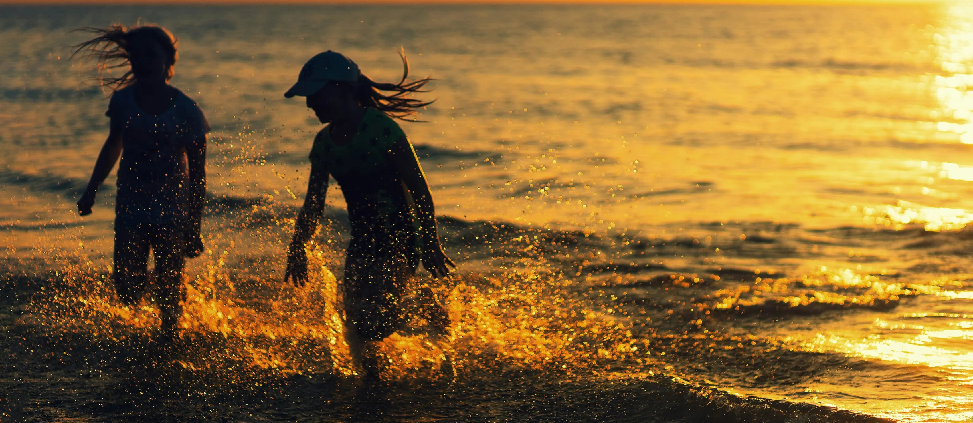 Man's feet in cool swimming pool water