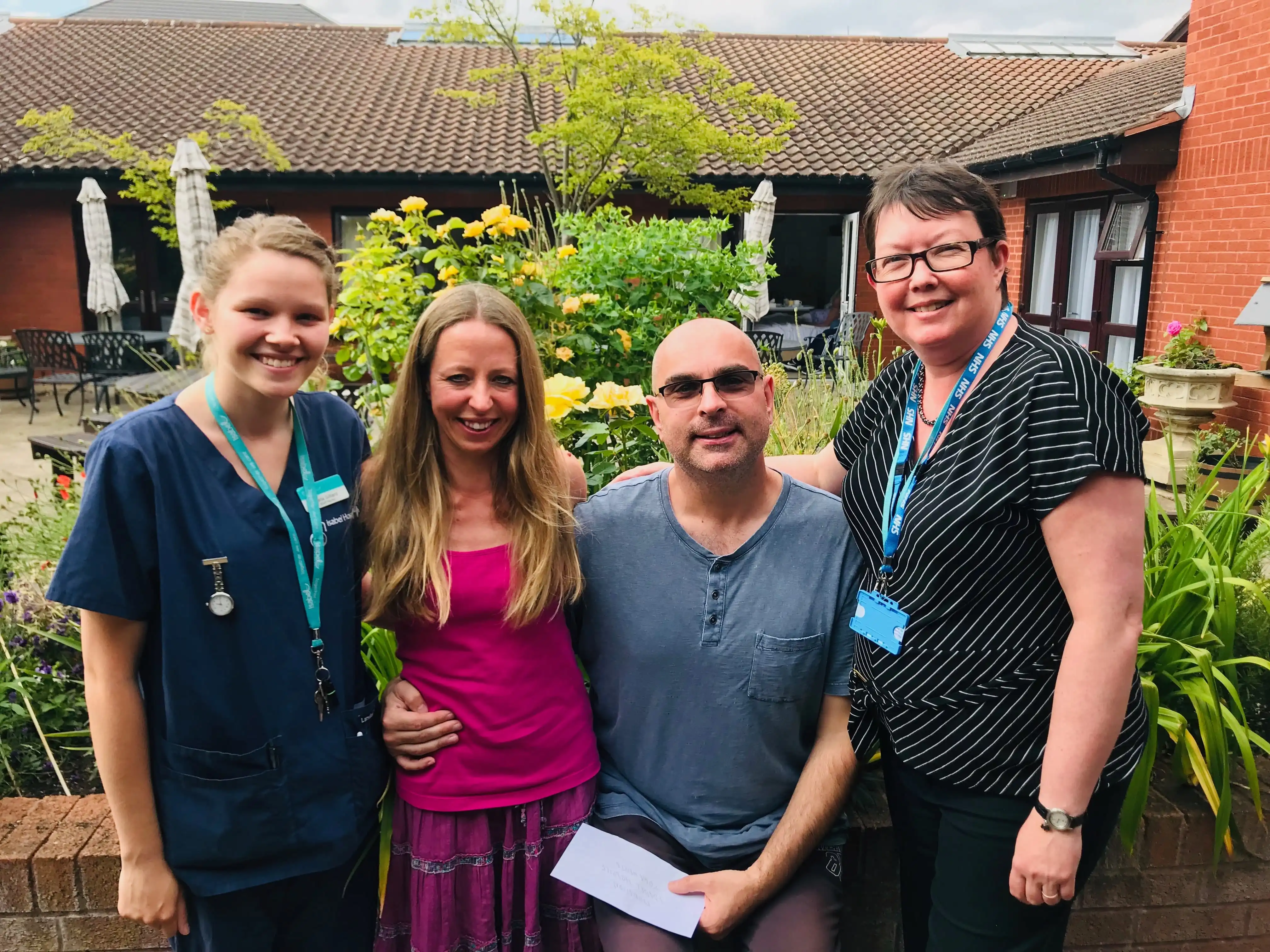 Carla, Vicky, Richard (with the cheque) and Angie.