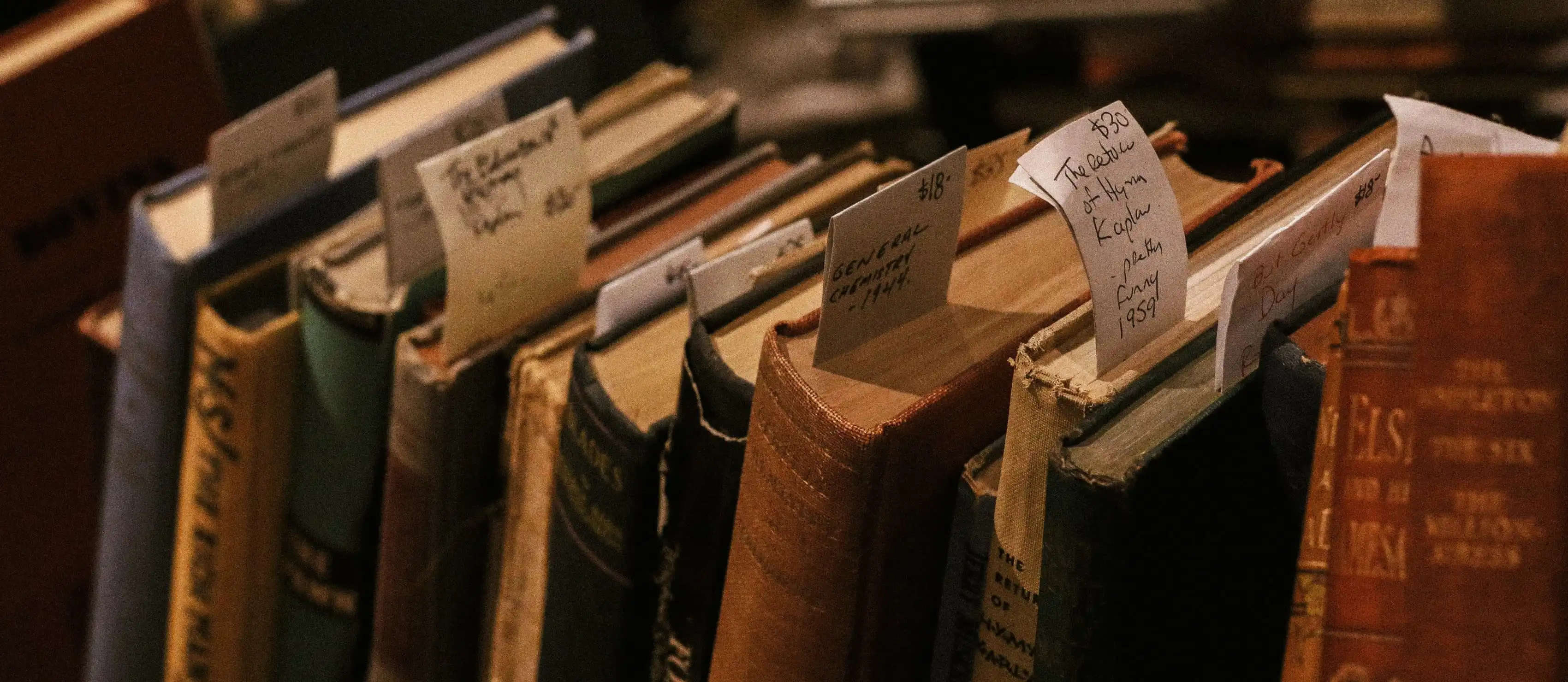 Close up of some dusty old books.