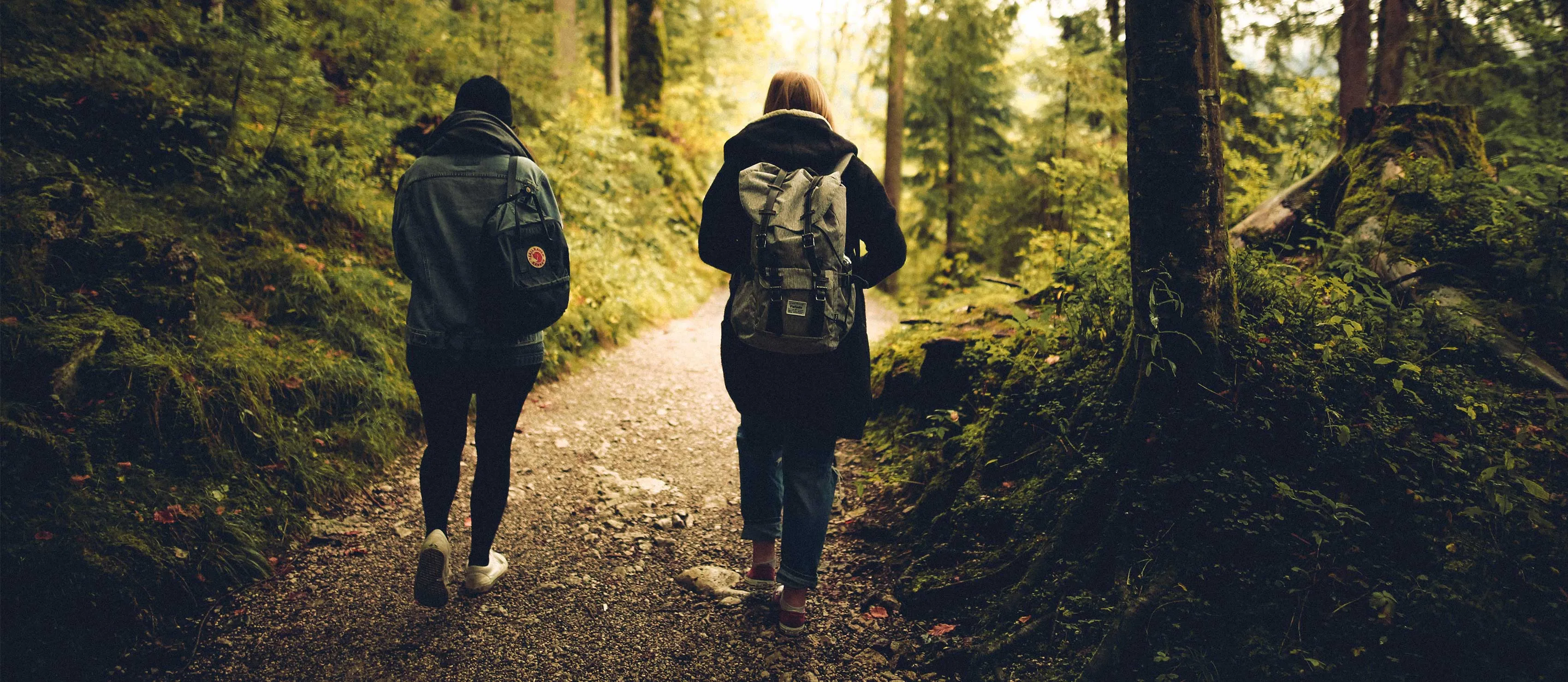 Man and woman walking in woods