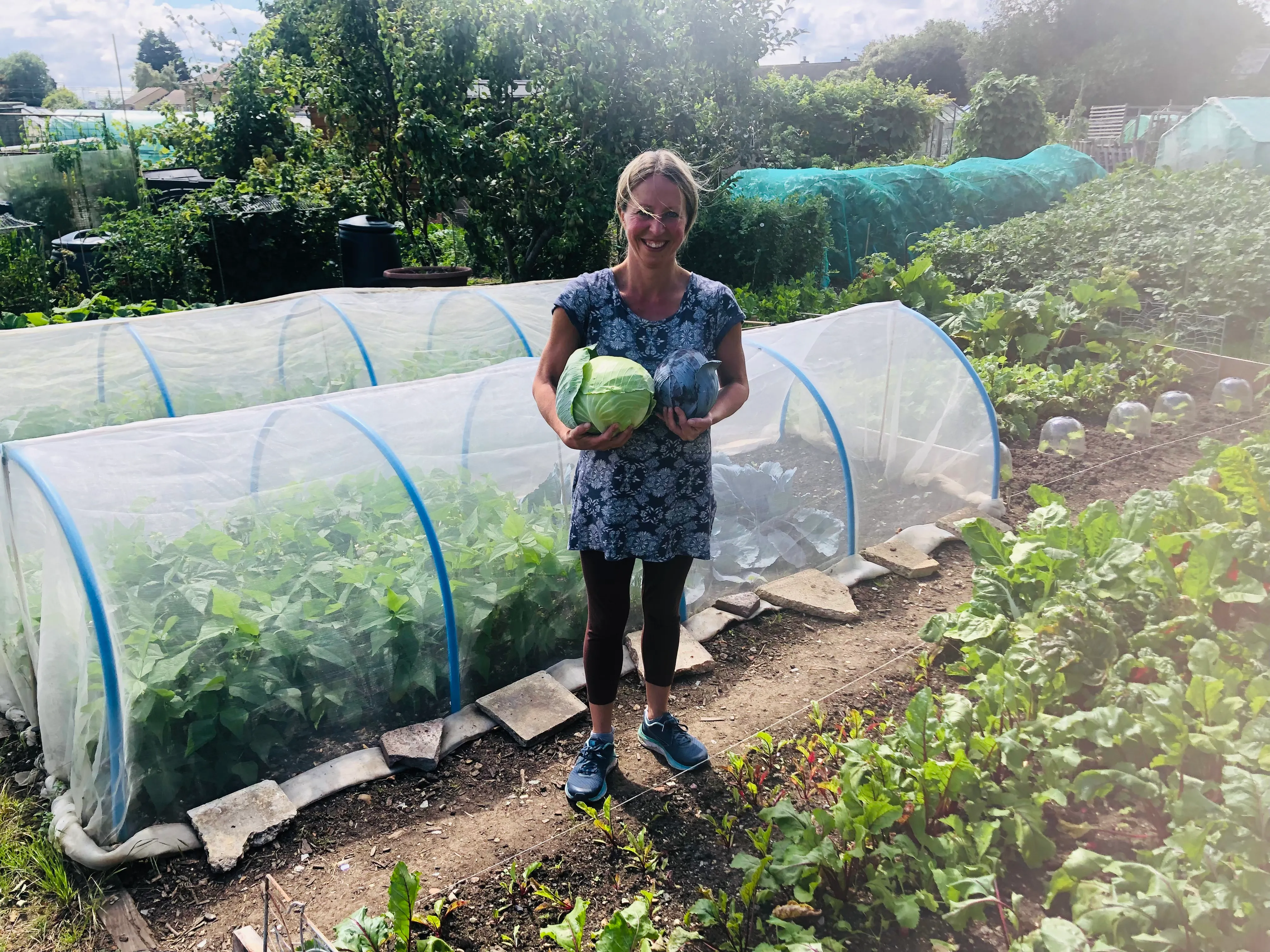 Vicky Salter holding a cabbage from the allotment.