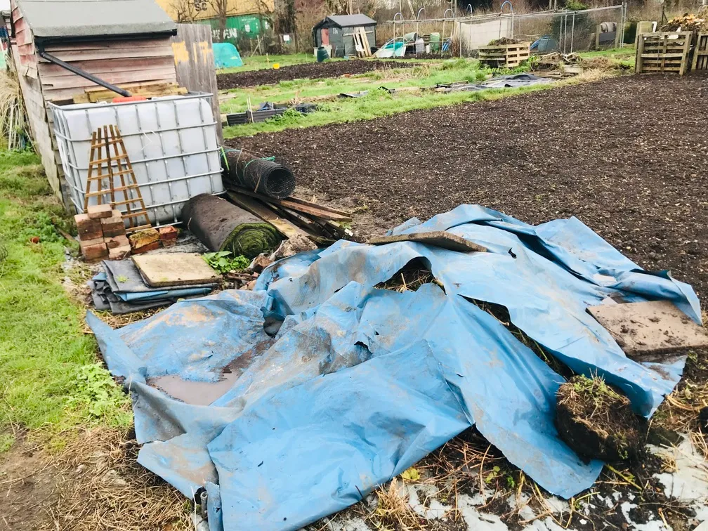Clearing an allotment plot.