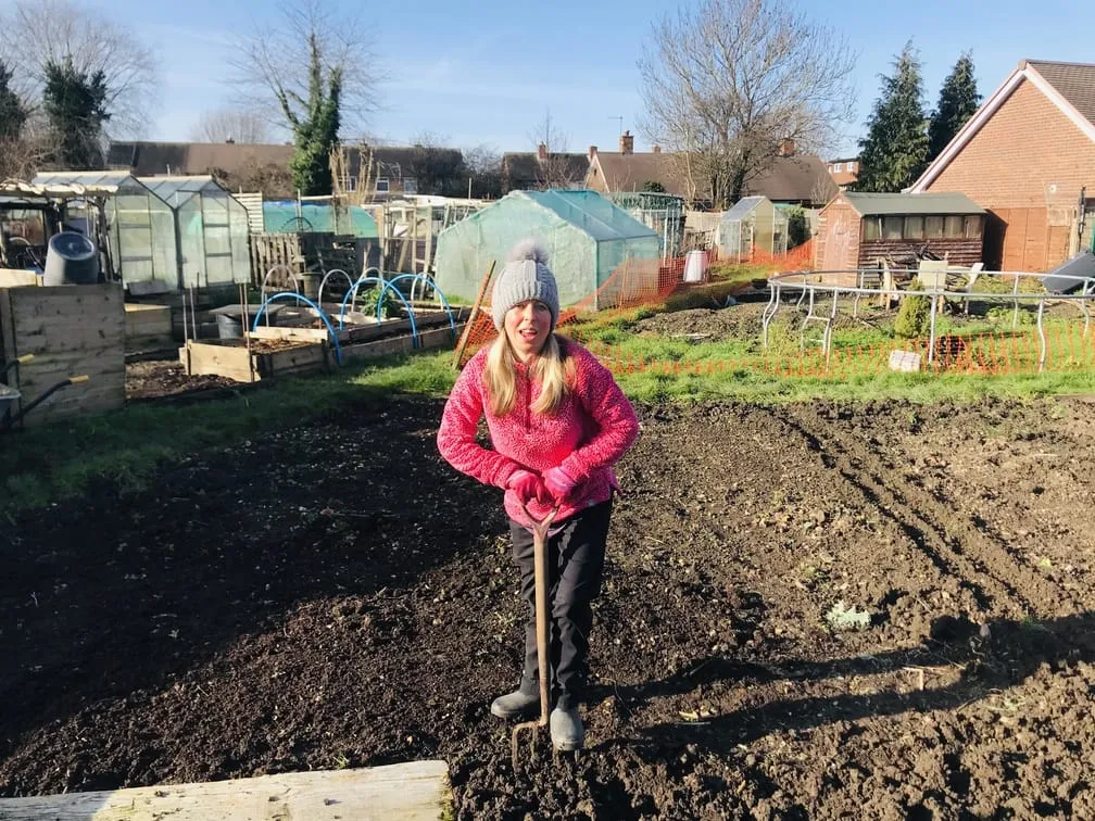 Digging an allotment plot.