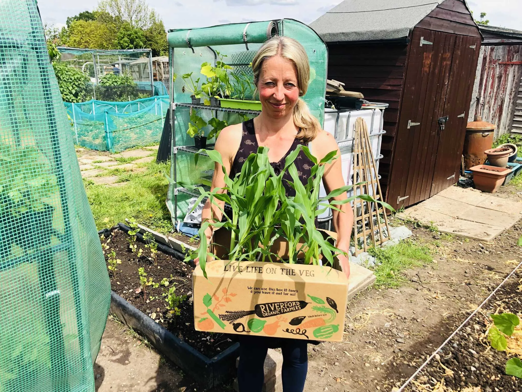 Vicky Salter holding produce from allotment.