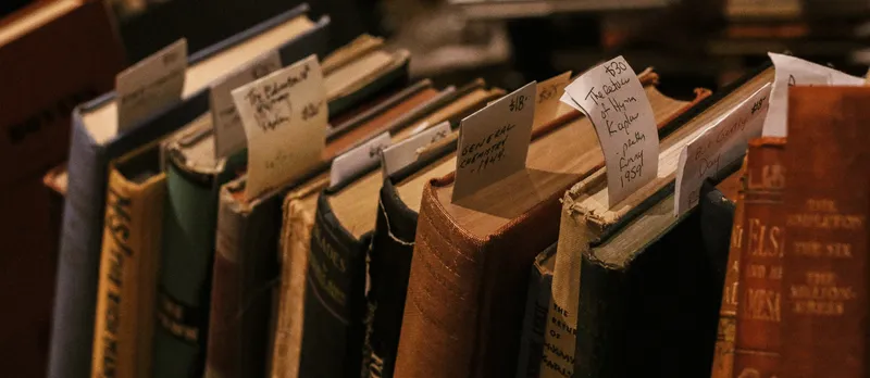 Close up of some dusty old books.