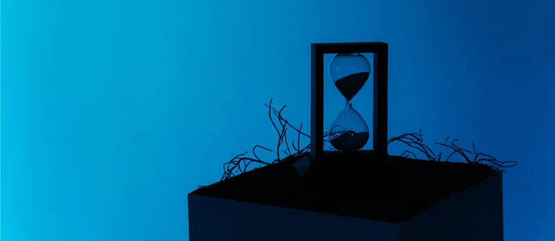 Sand timer on a blue background