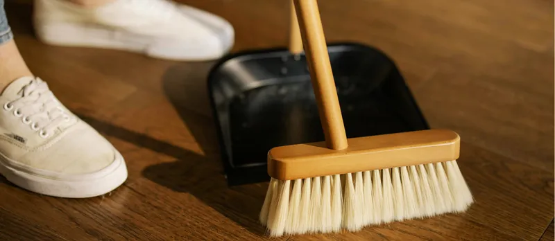 Sweeping up the floor with a broom