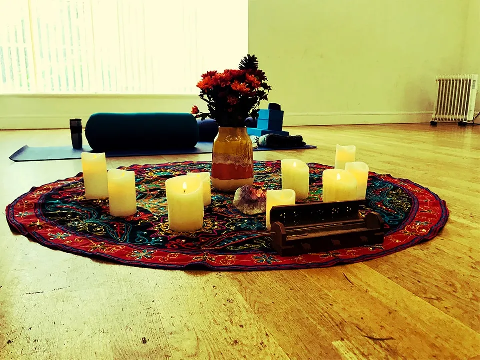 Candles on a round mat.
